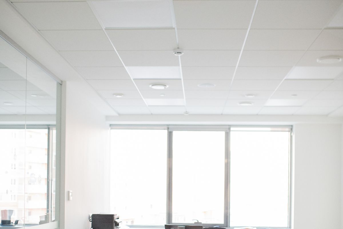 White PVC ceiling tiles being used in an office